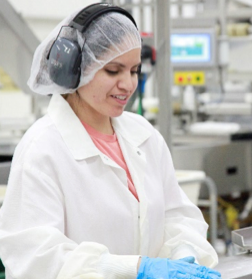 Production Worker working on the processing line at Salm Partners in Denmark Wisconsin